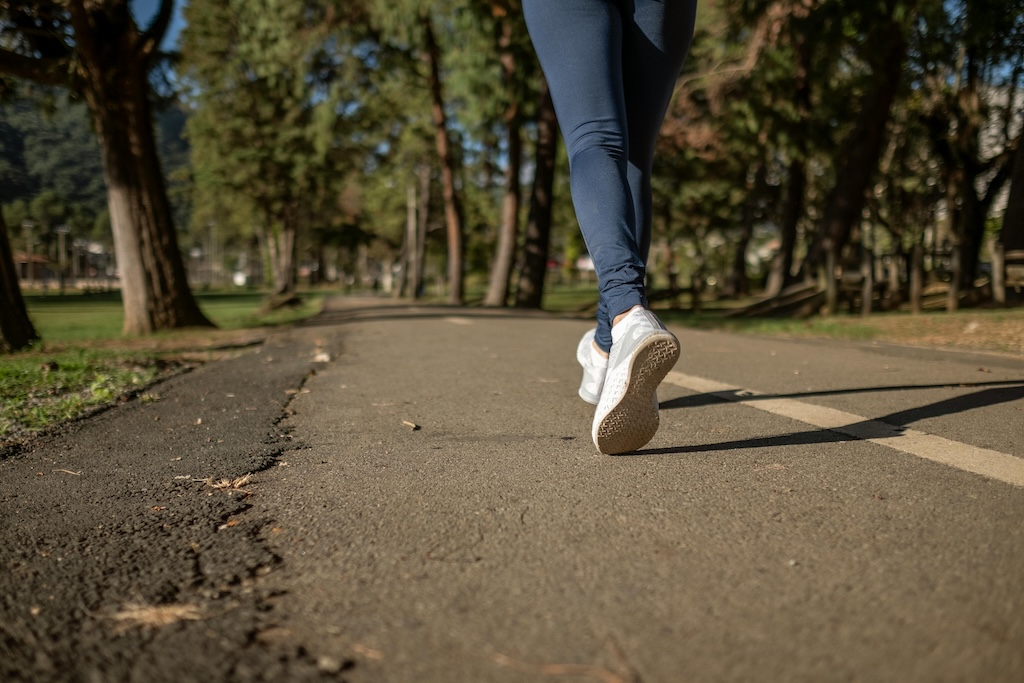 Close-up of person walking in the park